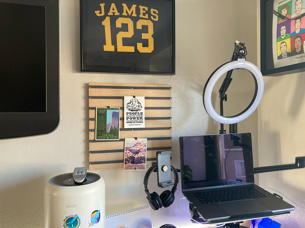 Photo of desk area with display board surrounded by other wall hangings and desk accoutrements