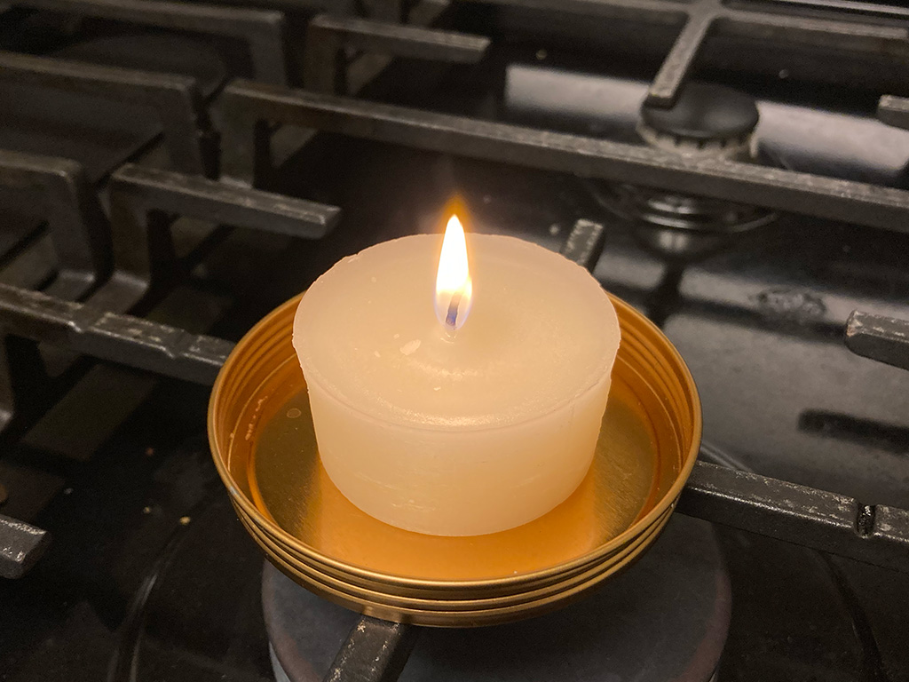 Photo of lit candle made with 3D printed mold