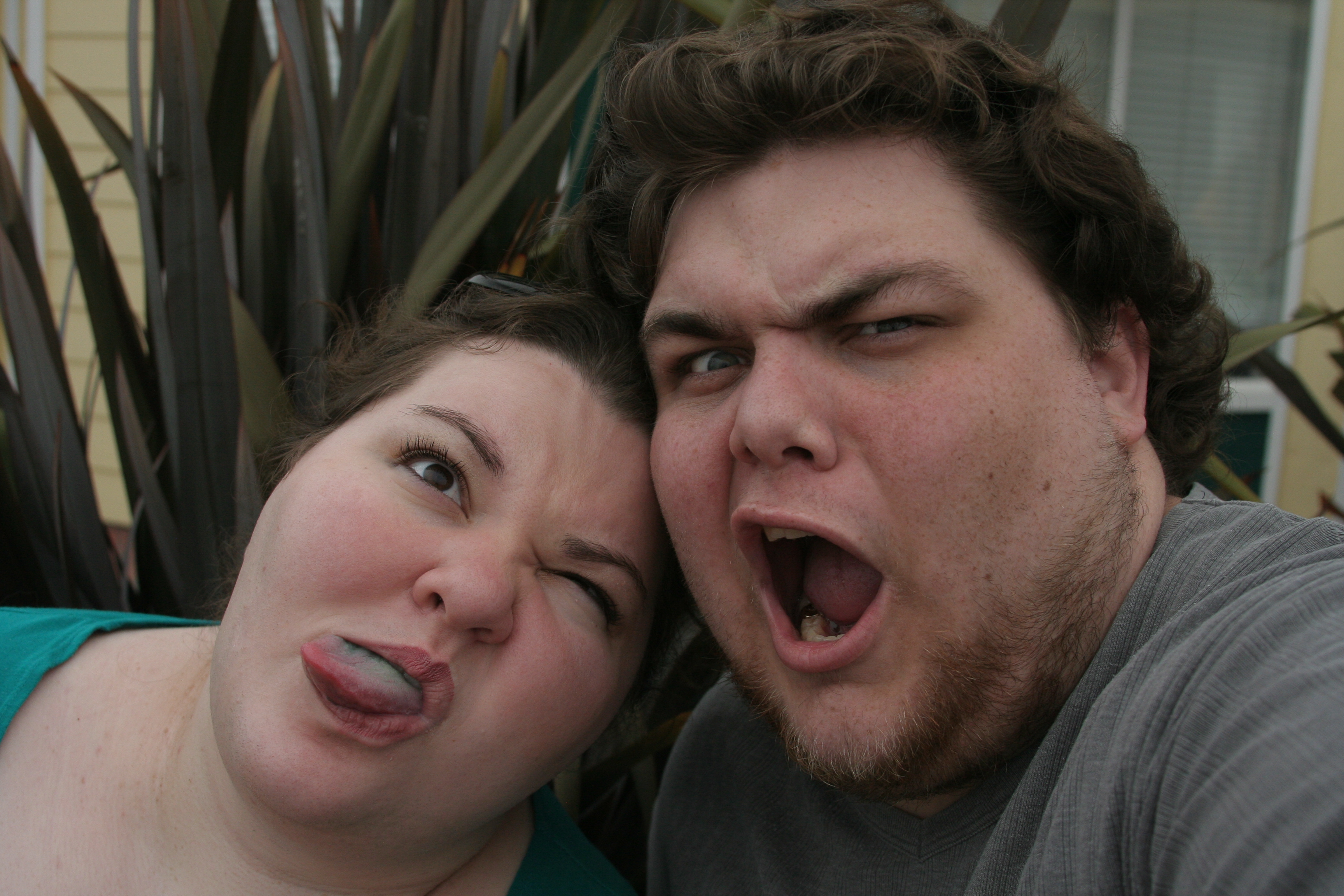 Bonnie and Daniel from 2009. Bonnie is sticking her blue-stained tongue out, and Daniel is making a contorted face with mouth agape.