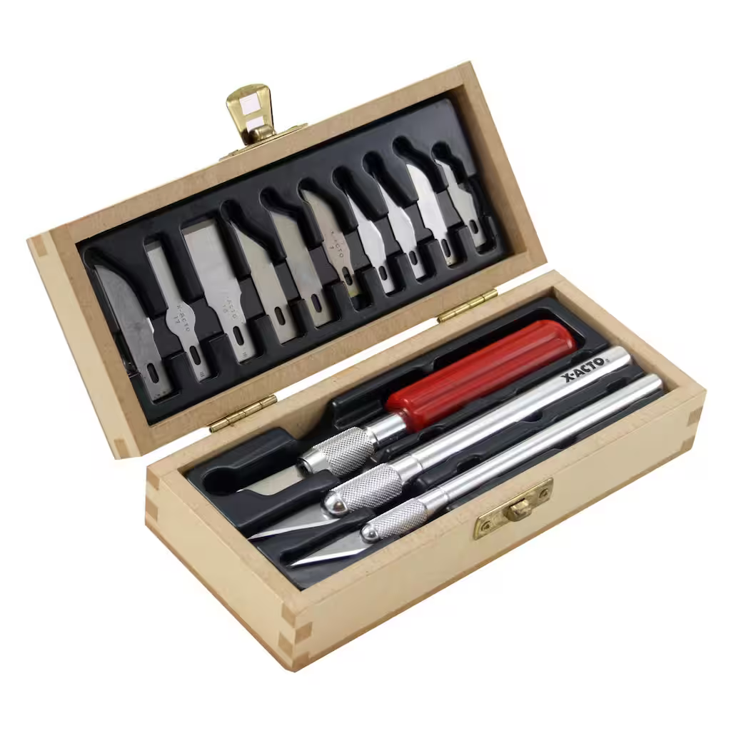 Official product photo of the X-ACTO Basic Knife Set hinged box showing ten blades set in a plastic shell inside the lid and three blade handles in the base