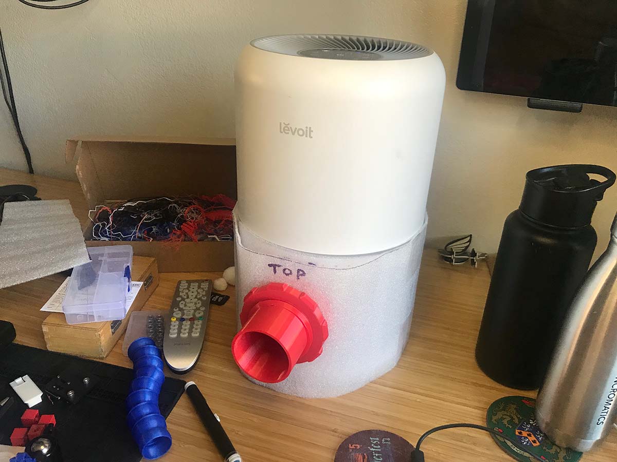 The assembled adapter fitted to the air purifier