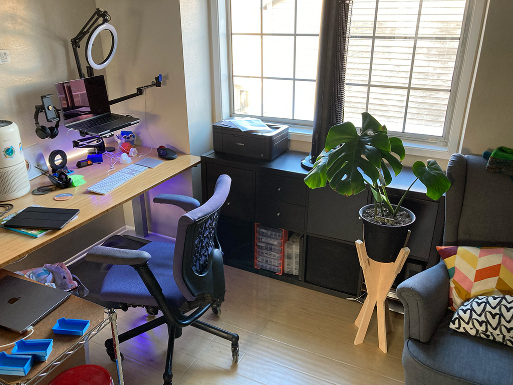 Photo of stand with plant in office