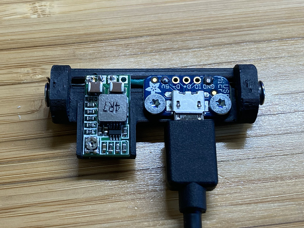 Photo of assembled shim plugged into a USB micro cable